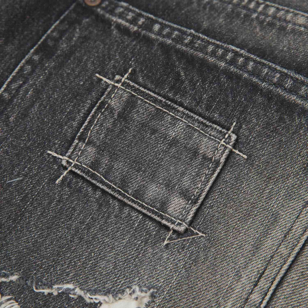 MADNESS HARD AGING DENIM PANTS. RELAXED (DAMAGED AND